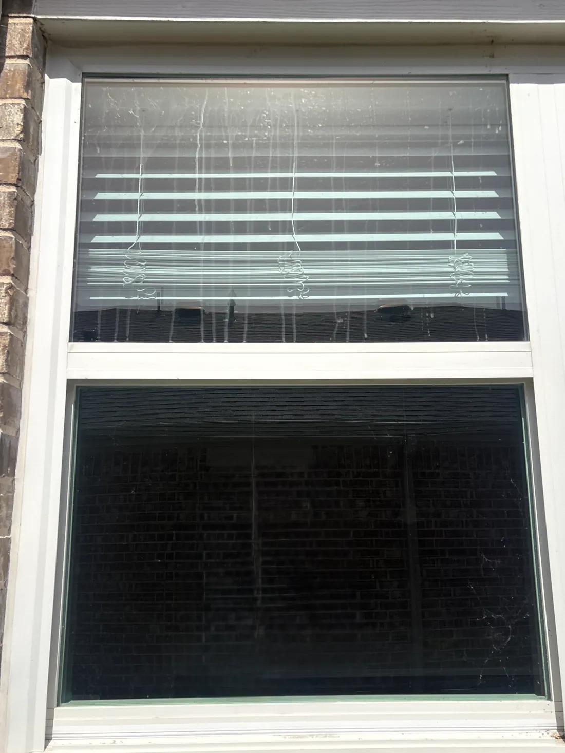 Dirty, hard-water-stained windows before professional cleaning